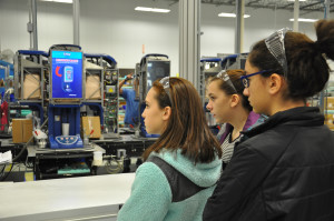 From left, Long Trail seventh graders Savannah Petrossi and Ella Masker, along with Long Trail eighth grader Shaye Squillante, visit an assembly line during a visit to the Company’s headquarters in Arlington, Vt., Wednesday, Jan. 13, 2016.