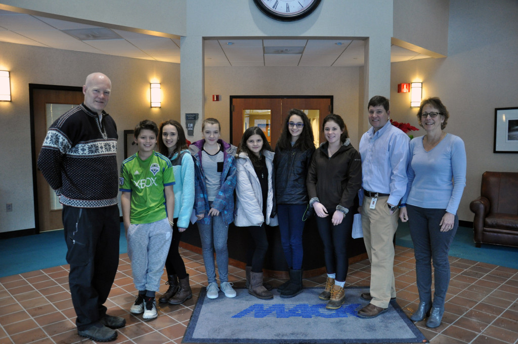 Pictured, from left, are Long Trail School Director of College Consulting & Athletics Scott Magrath with students Bryce Coe, sixth grade; Savannah Petrossi, seventh grade; Ella Masker, seventh grade; Sophia Berumen, sixth grade; Shaye Squillante, eighth grade and Shayla Sisters, eighth grade; along with Mack Molding HQ Plant Manager Rich Hornby and Director of Human Resources Nancy Cefalo. Students toured the Company’s headquarters in Arlington, Vt., Wednesday, Jan. 13, 2016, to learn how business operate in the region as part of the school’s Made in Vermont program.