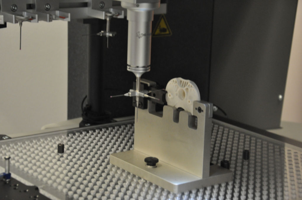 A part is measured in Mack Molding's metrology lab