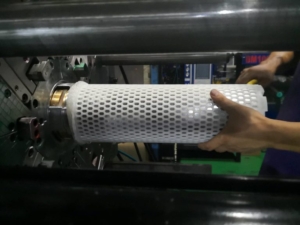 This picture shows a basket in which a capsule holding an RFID chip has been insert molded into the part. Overmolding and Insert Molding.