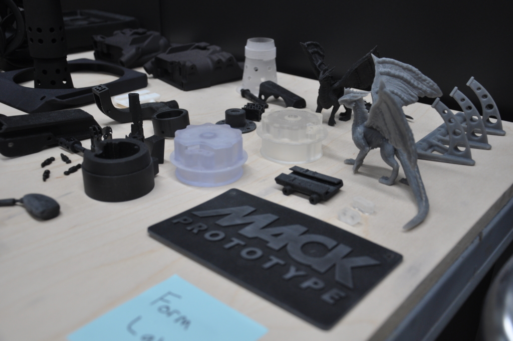 Samples of parts made using 3D Printing, including device covers, connectors, even a dragon