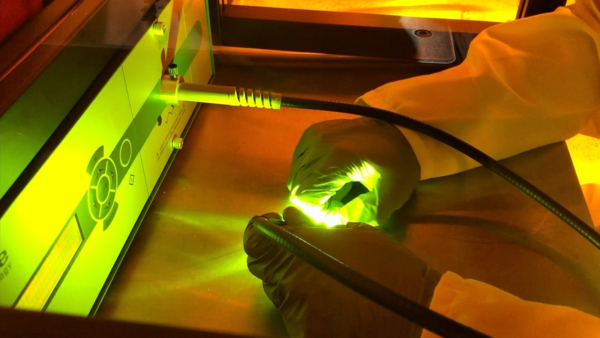Technician working with a laser engaging in Product Design & Development