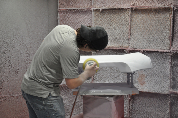 Fine sanding a surface for fresh painting & finishing service.