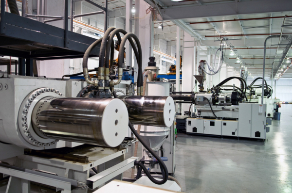 Photo of a row of Plastic Injection Molding machines.